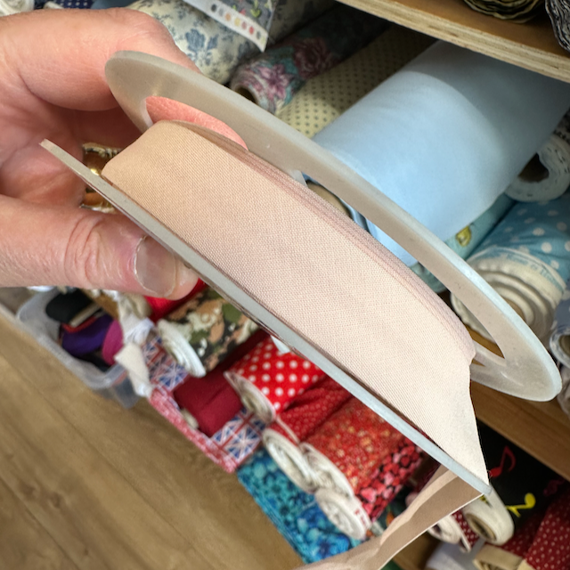 Peach  plain folded bias binding 16mm wide, per metre