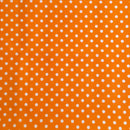 Orange polka dot polycotton fabric